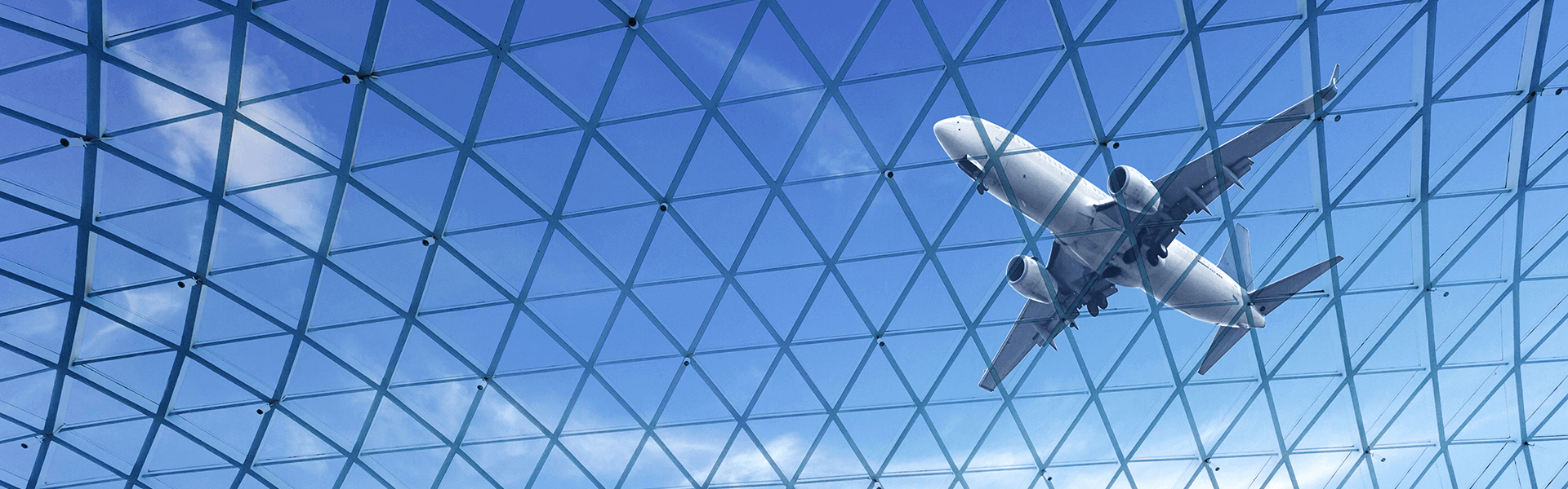 Plane flying above a glass ceiling