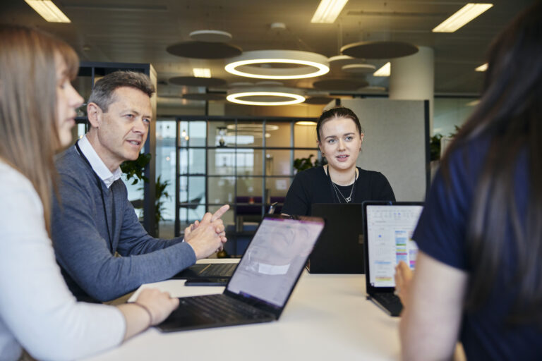 small group people in discussion in an office