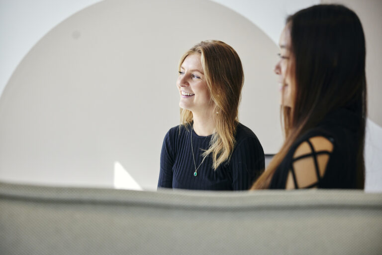two people smiling
