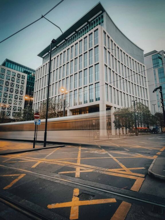 Corporate building by yellow cross section of road markings, that could be occupied by compaines from the real estate finance sector