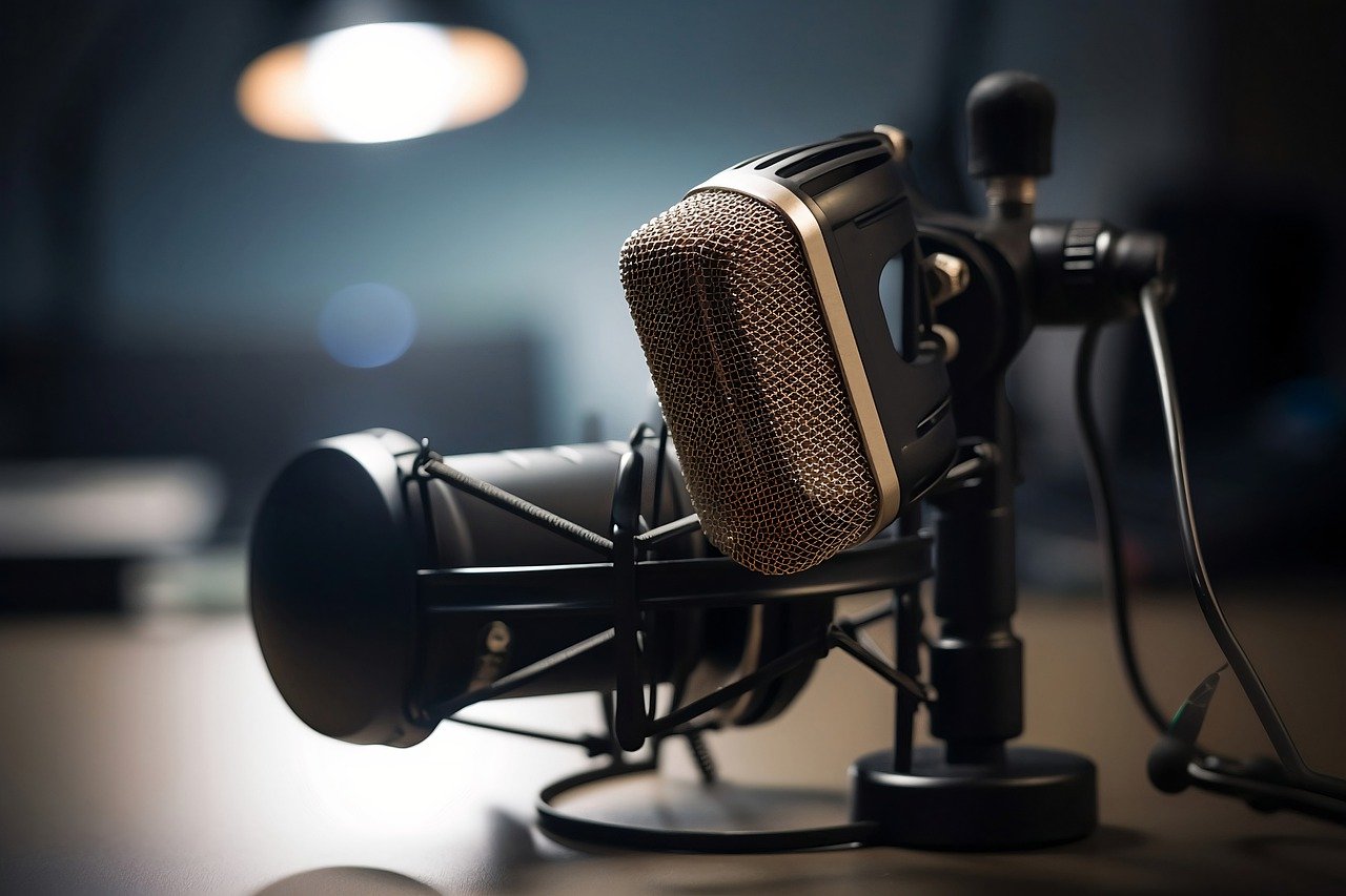 Two podcast microphones on a desk