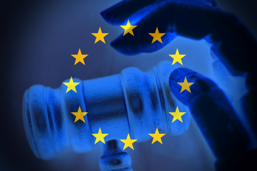 EU regulation concept with hand and wooden gavel