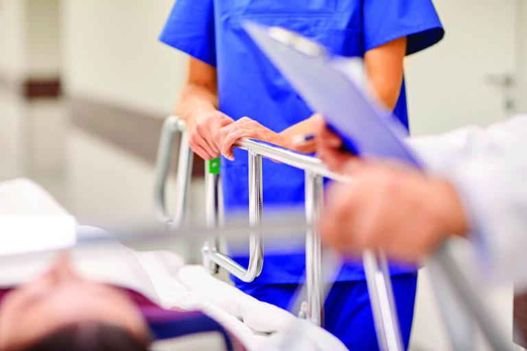 Healthcare professional patient on gurney hospital