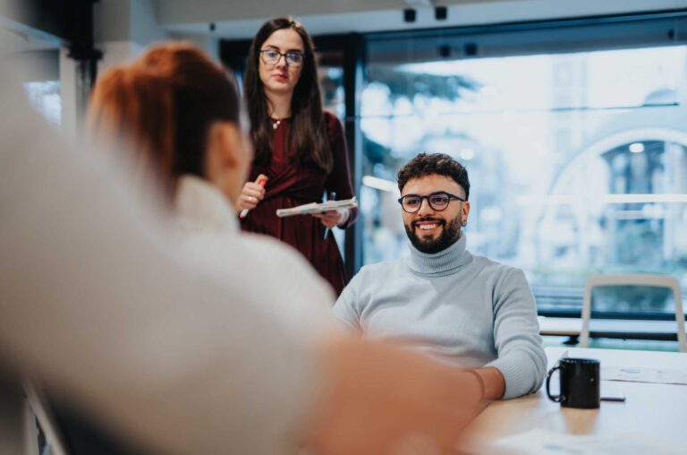 Four professionals in discussion in office