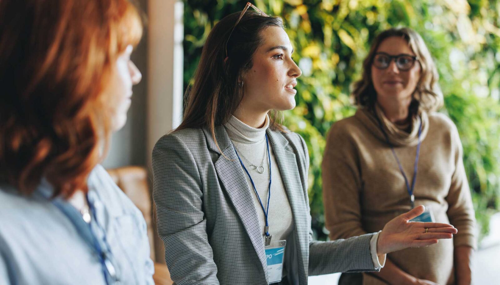 Three professional women in discussion