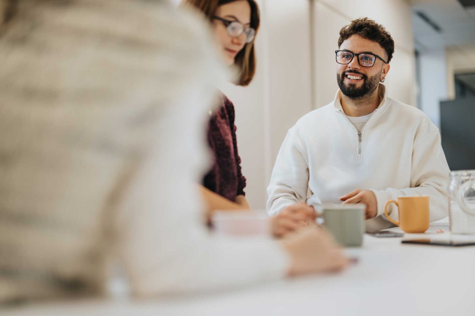 Three professionals in discussion in office