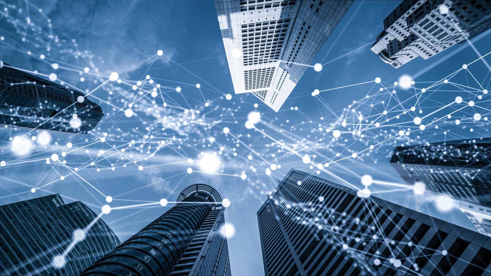 Ground-level view of skyscrapers with tech network overlay