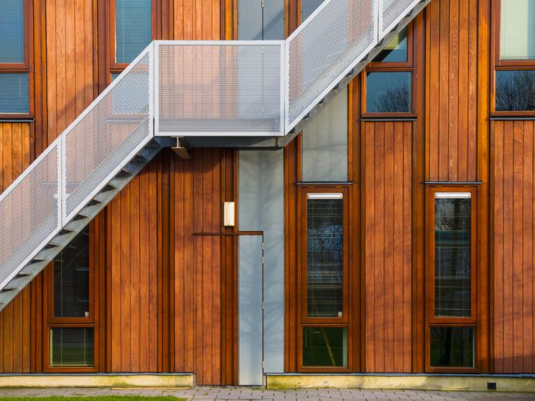 picture of a close up of a wooden building with external staircase
