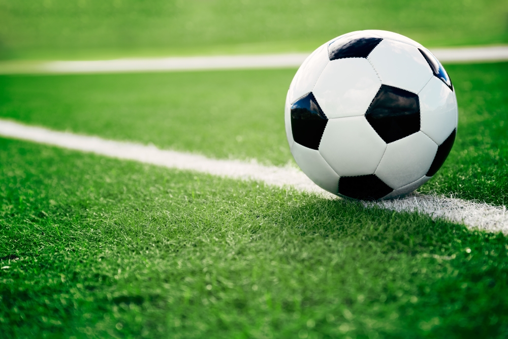 Traditional football on pitch