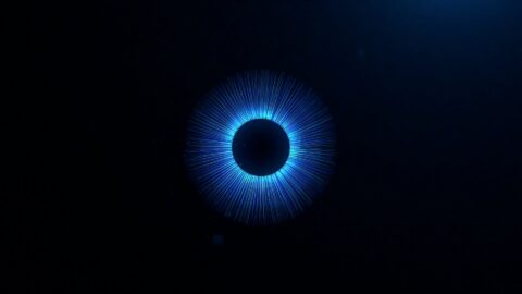 A black screen with blue digital lights coming out from the centre in a circular manner