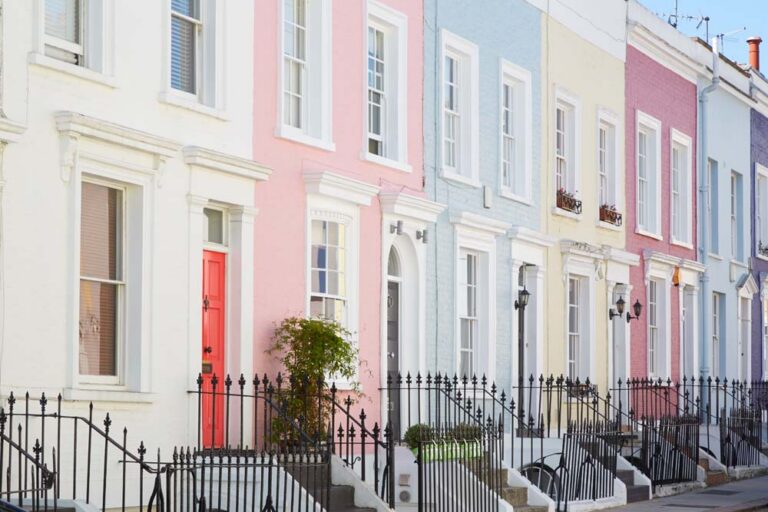 Colorful English houses facades pastel pale colors in London