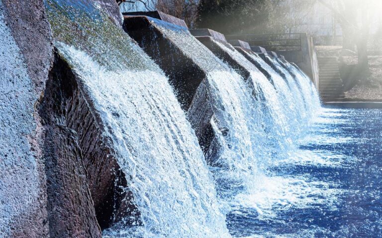 Water cascading through a series of channels at a water management structure