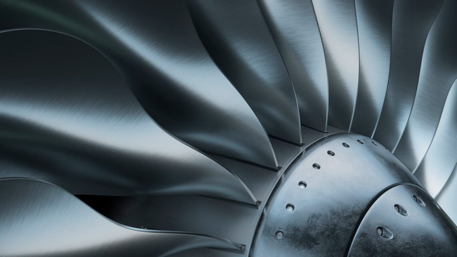 Close up image of the blades of a jet engine turbine