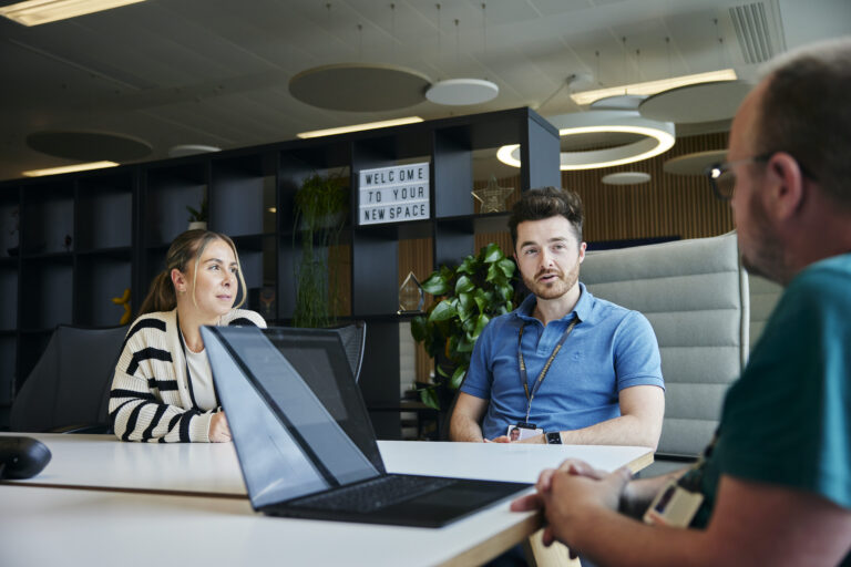 three people in a meeting